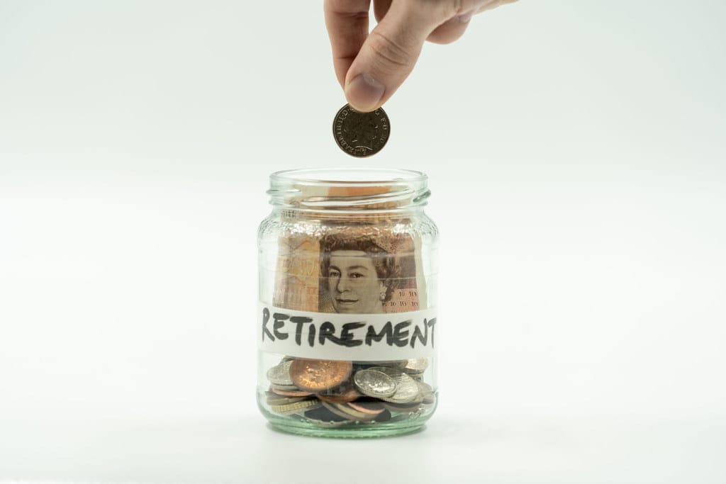 Coins and savings jar representing financial planning and saving for the future
