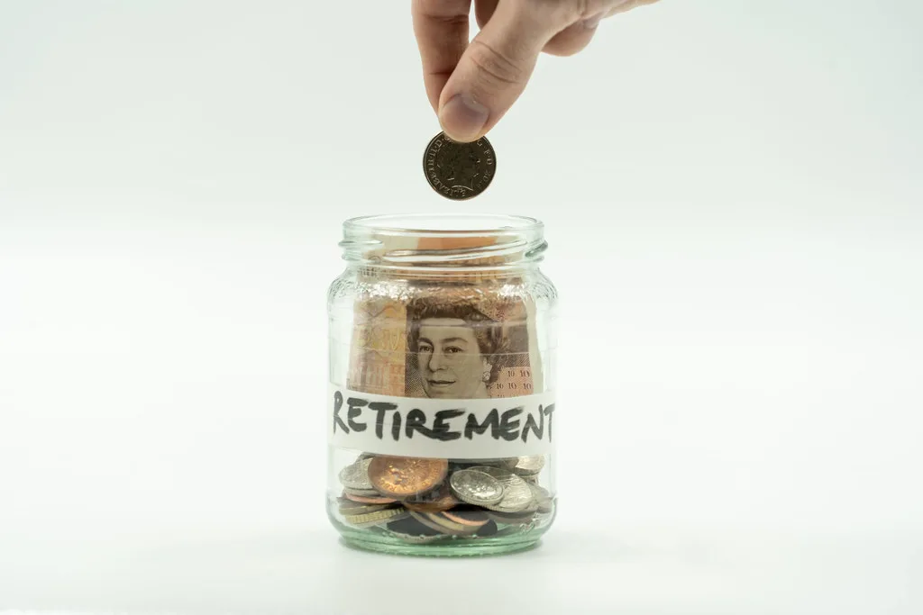 Coins and savings jar representing financial planning and saving for the future